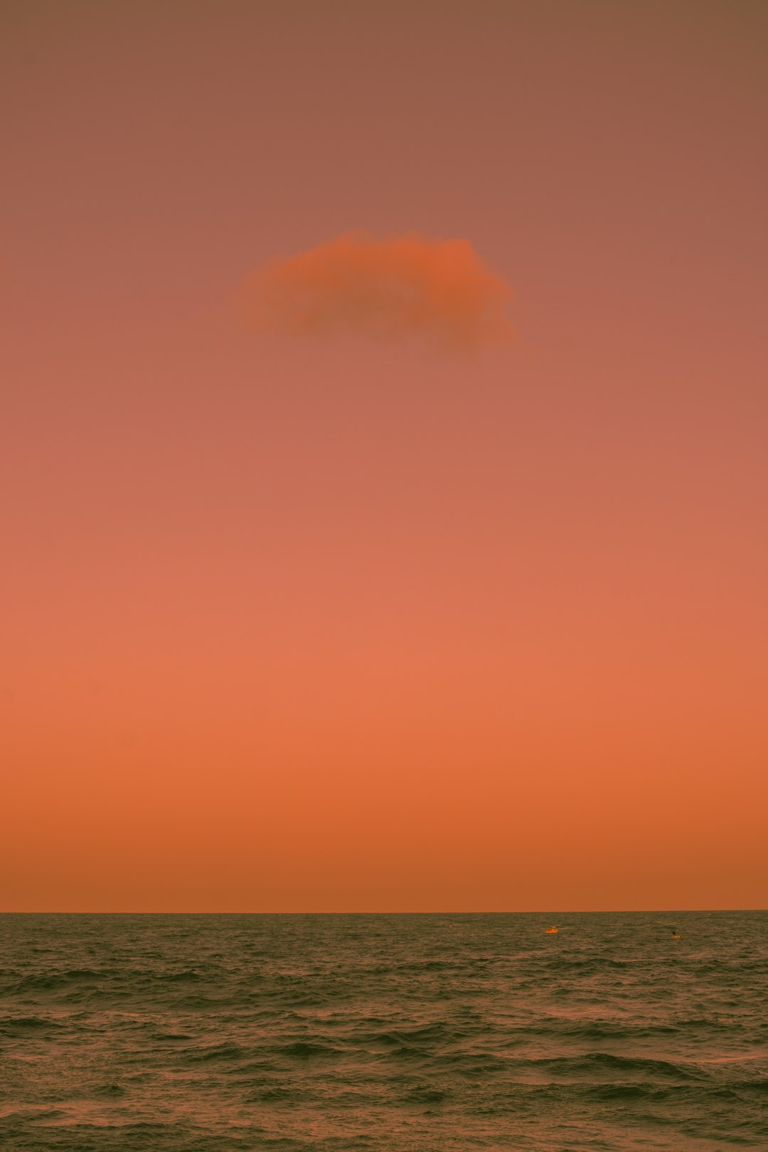 blue ocean under orange sky