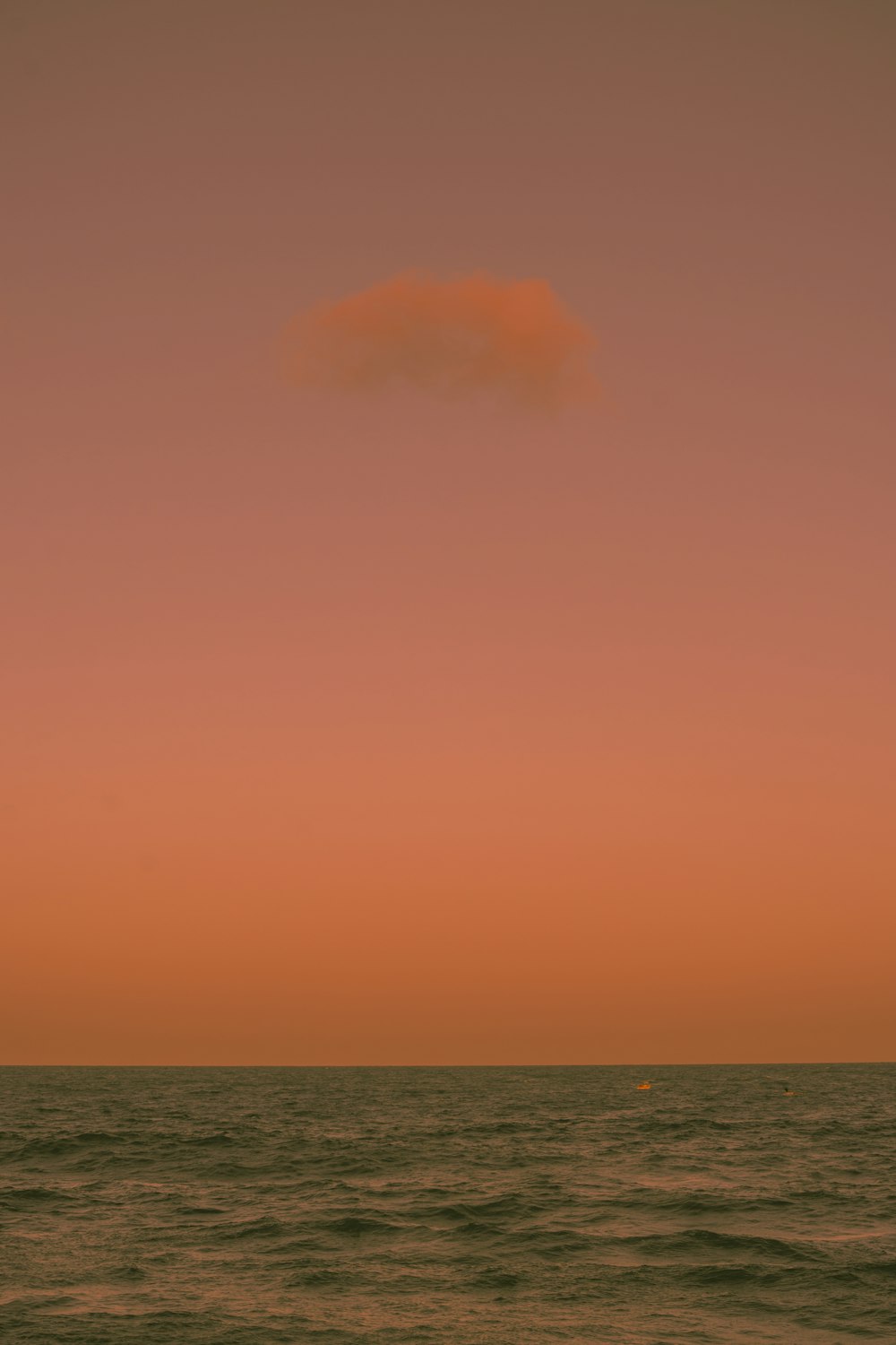 blue ocean under orange sky