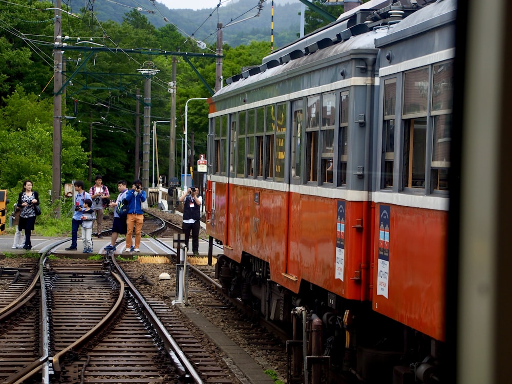 people standing on train station during daytime