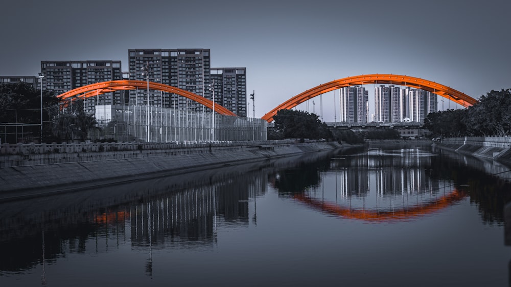 orange and white bridge over river