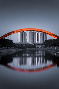brown arch bridge over river