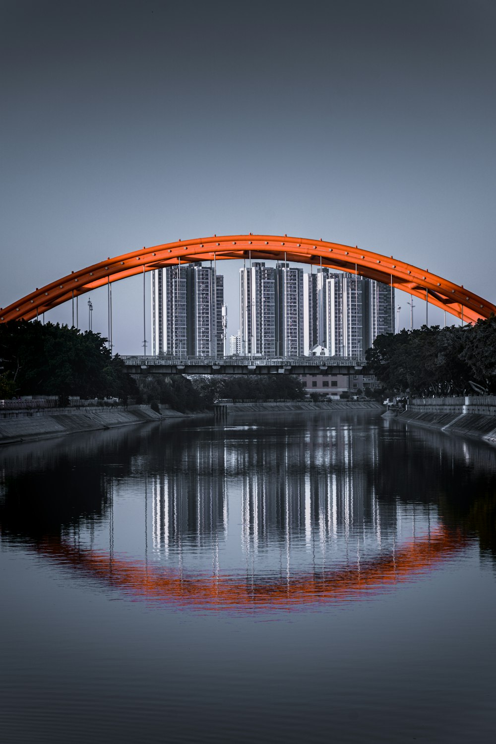 brown arch bridge over river