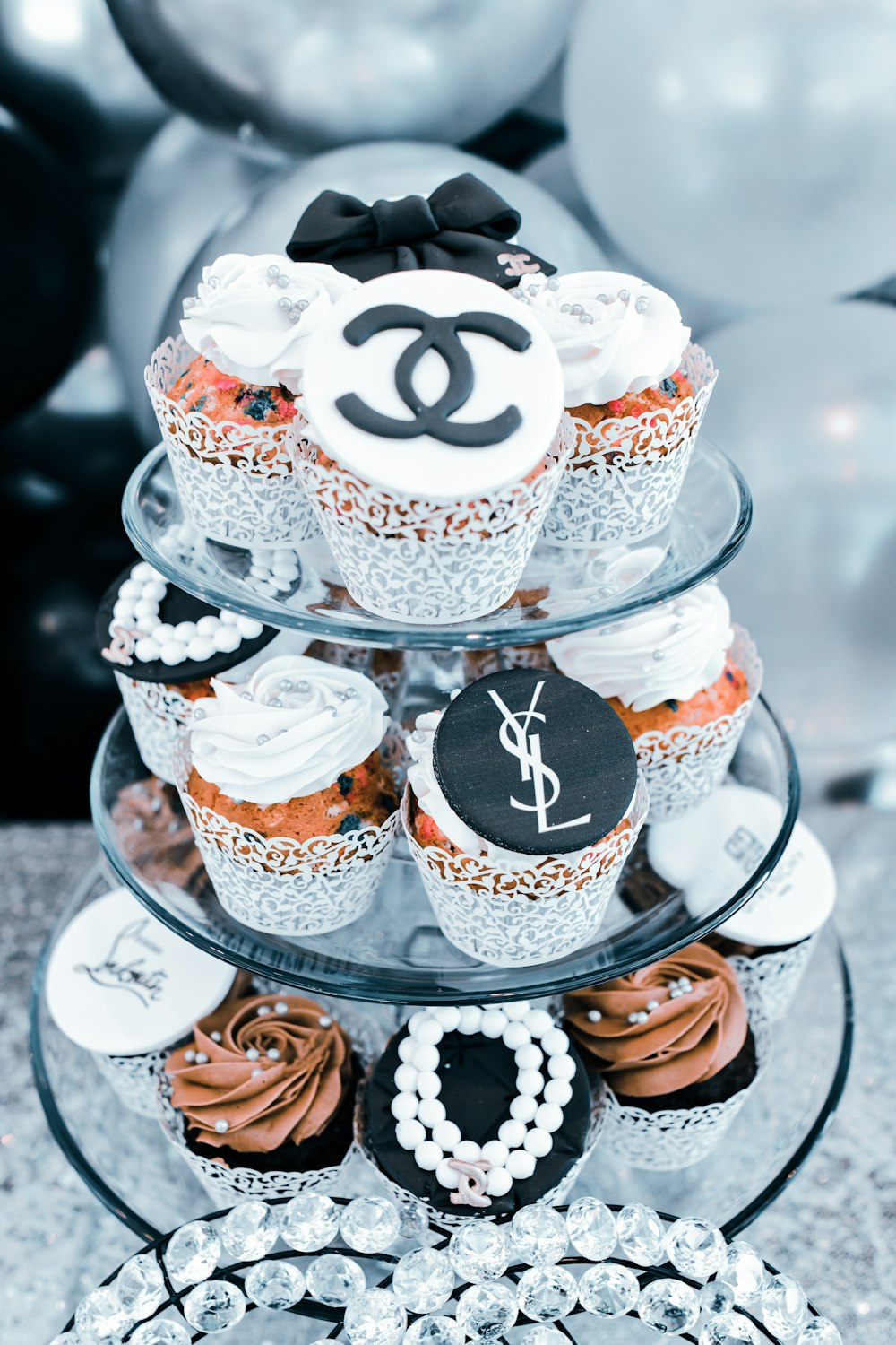 cupcakes on clear glass cake stand