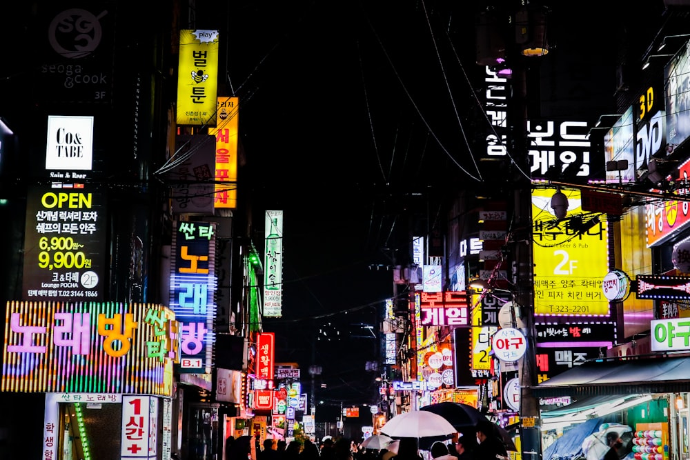 people walking on street during nighttime