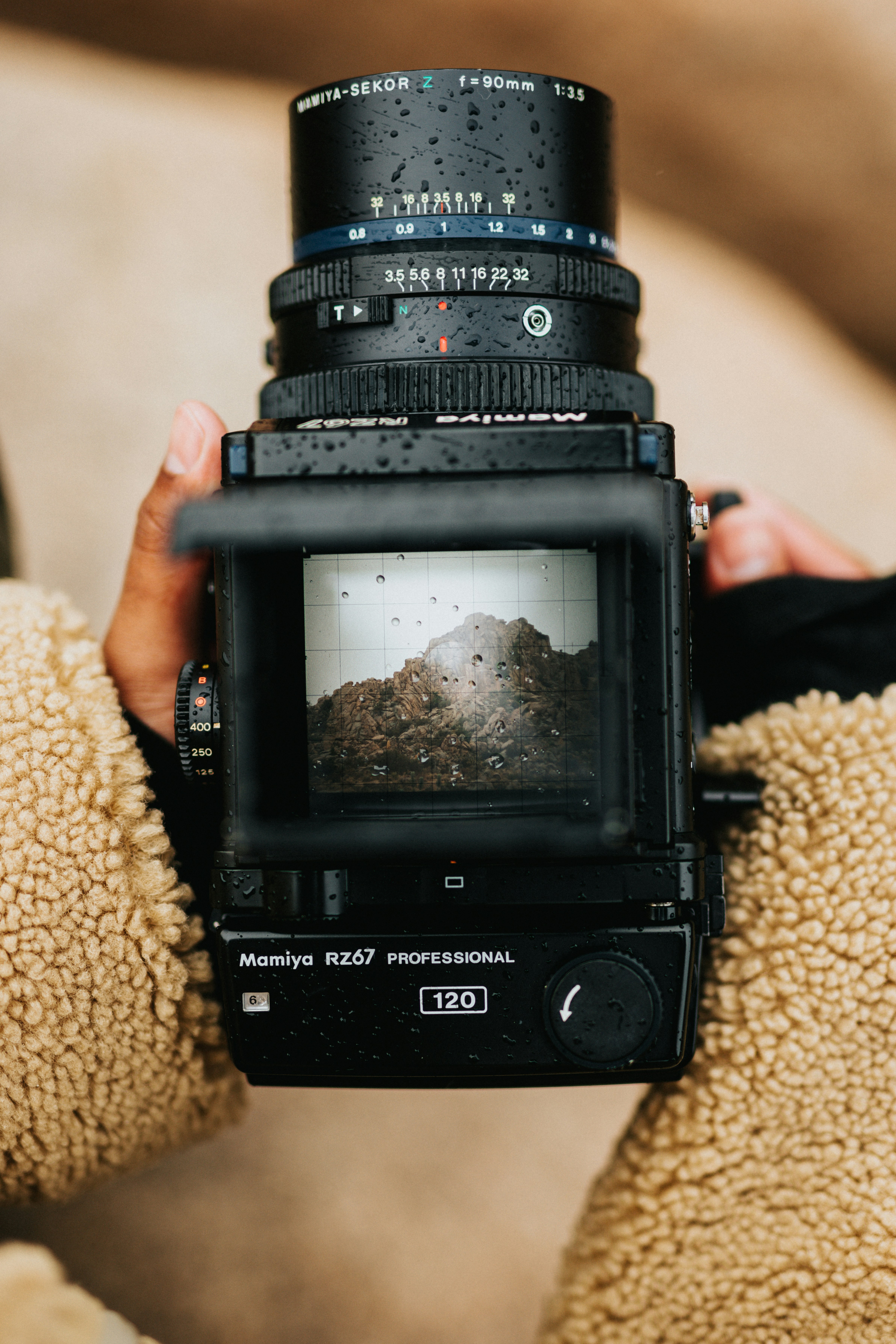 black-dslr-camera-on-brown-textile