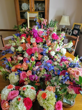 Close-up of a beautiful floral arrangement with fresh, bright blooms in a cozy home setting.