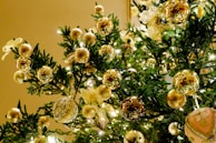 Luxurious gold foil accents on a card featuring a classic Christmas tree illustration.