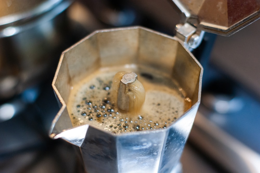 coffee in silver cup with coffee