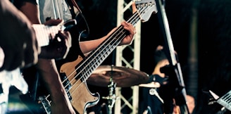 man playing guitar on stage