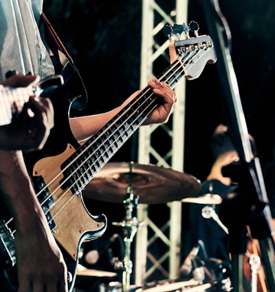 man playing guitar on stage