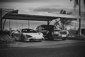 High-performance exotic car parked under a premium luxury car tent in North Philadelphia.