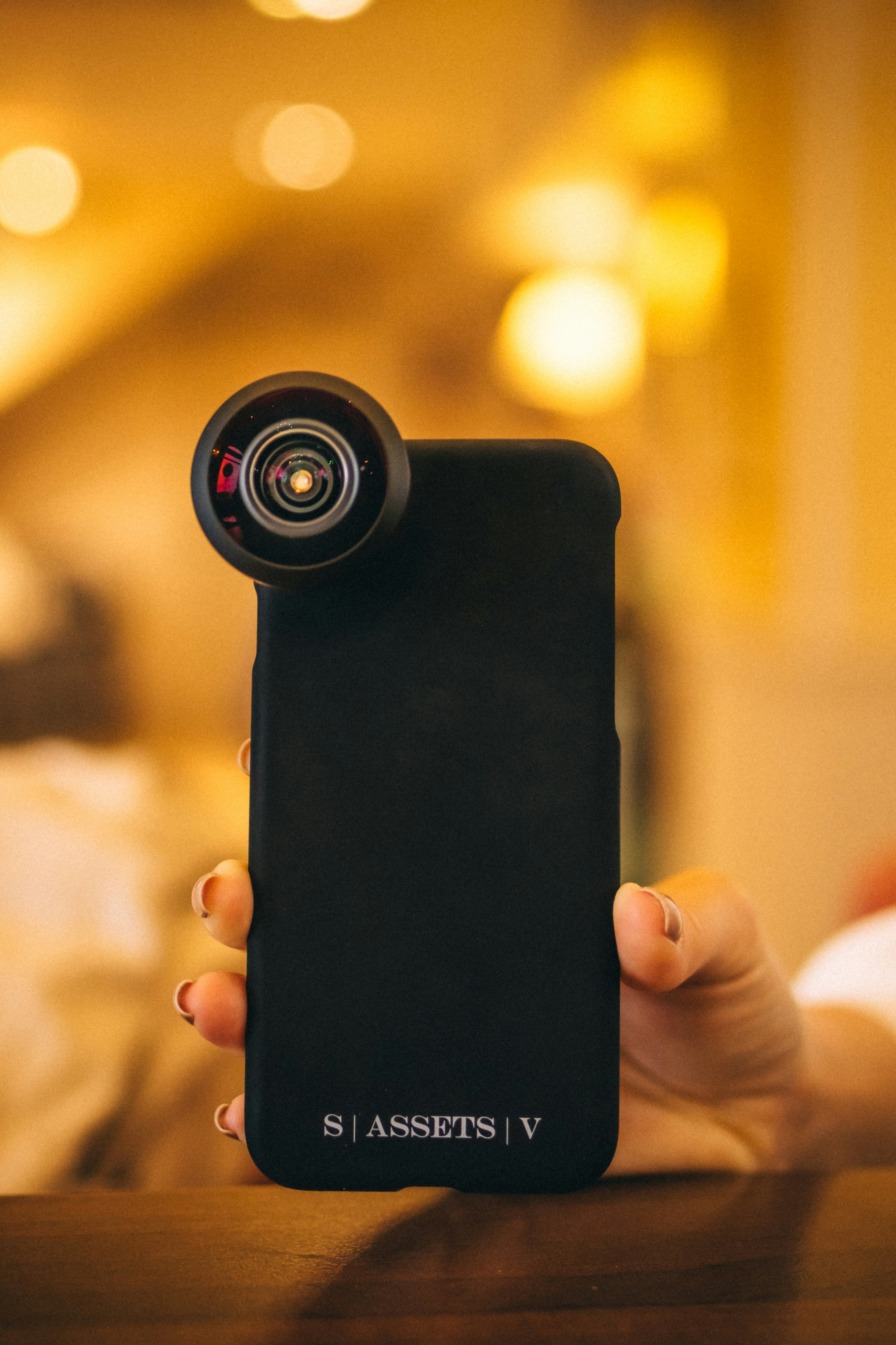 person holding black iphone 5