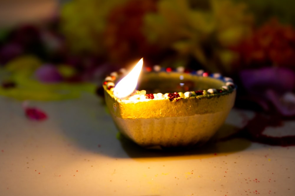 yellow and white lighted candle