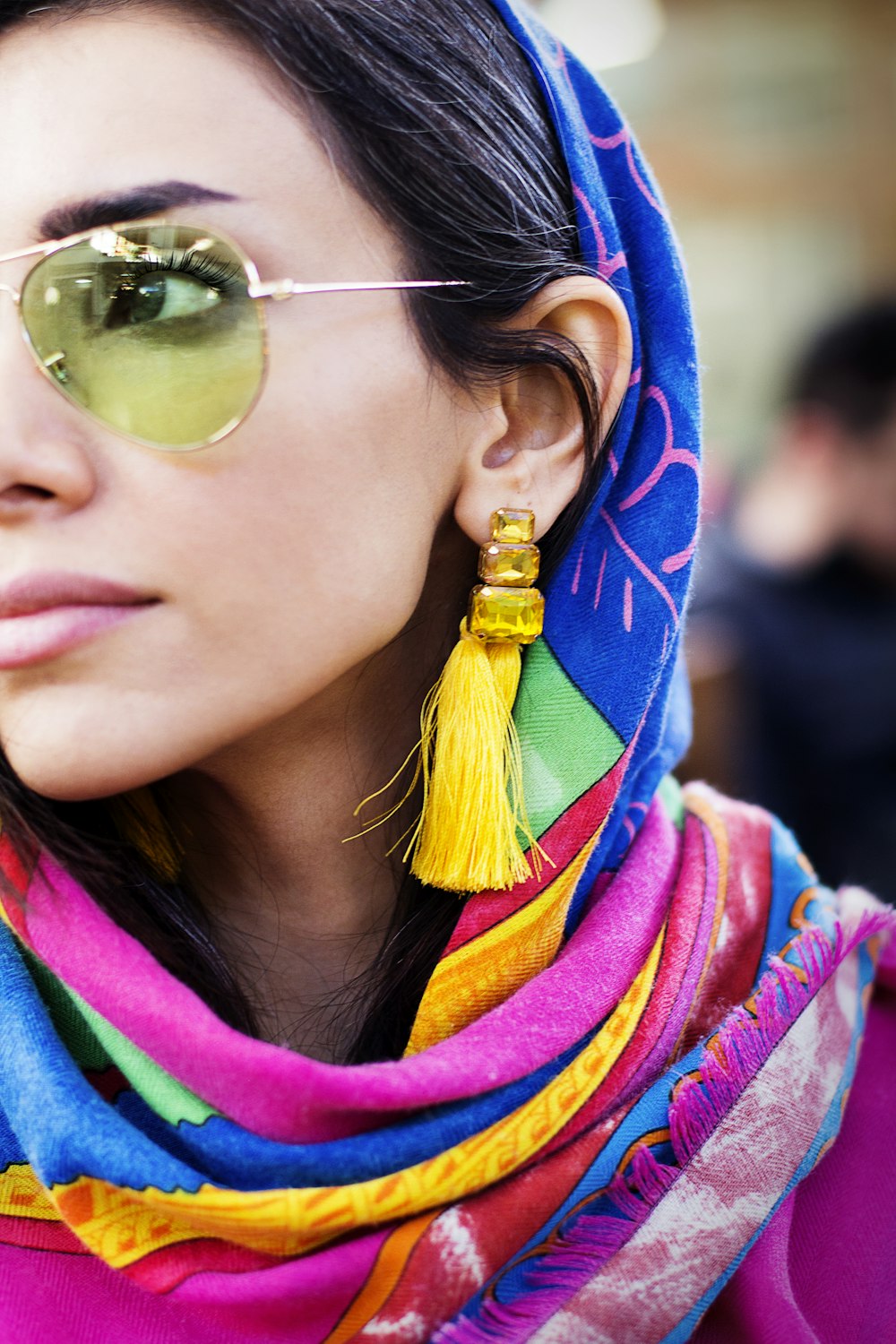 woman in blue and yellow hijab wearing gold framed aviator sunglasses
