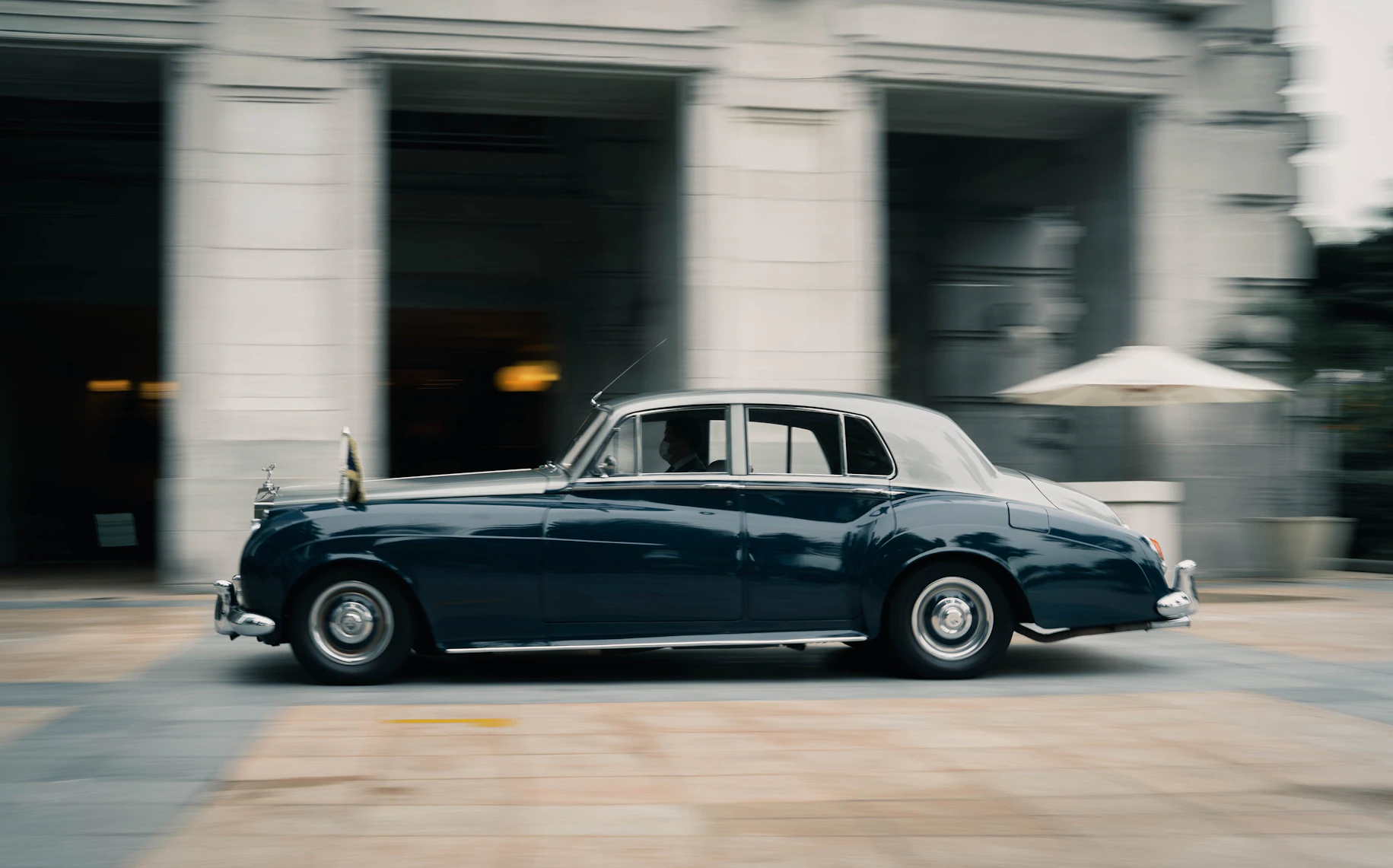 Motorcade vehicle in motion for managed principal transport