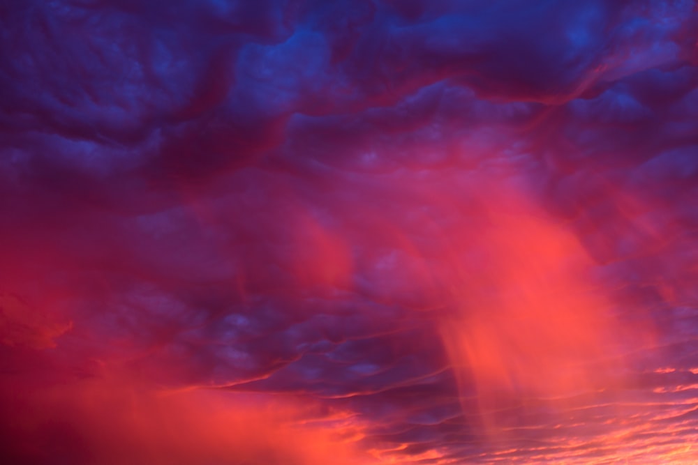 red and blue clouds during night time