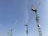 Several tall construction cranes extend into a clear blue sky, suggesting an area of significant construction and development.