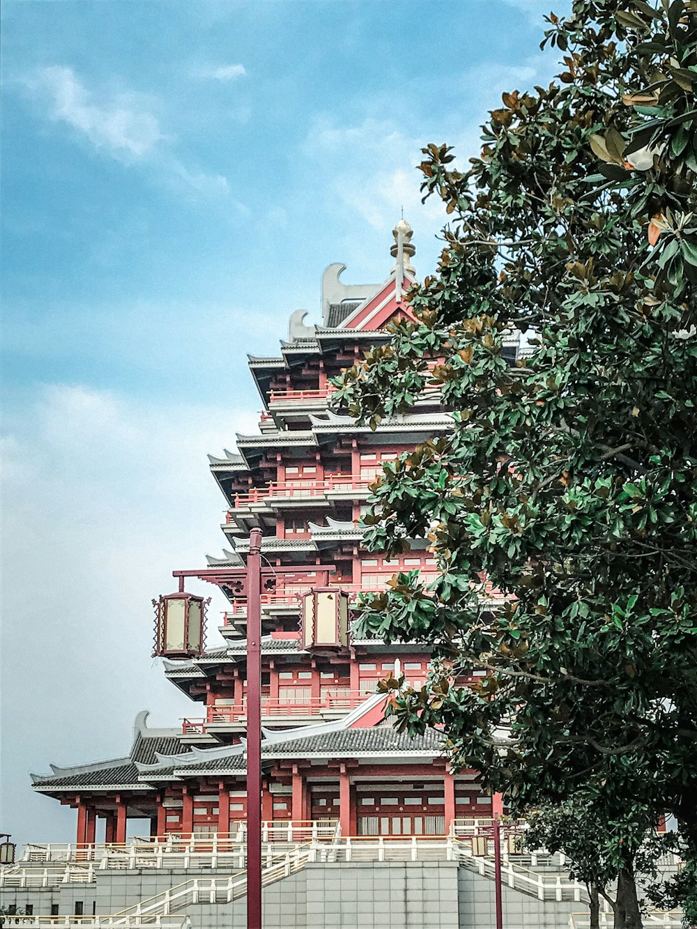 red and white concrete building under blue sky during daytime