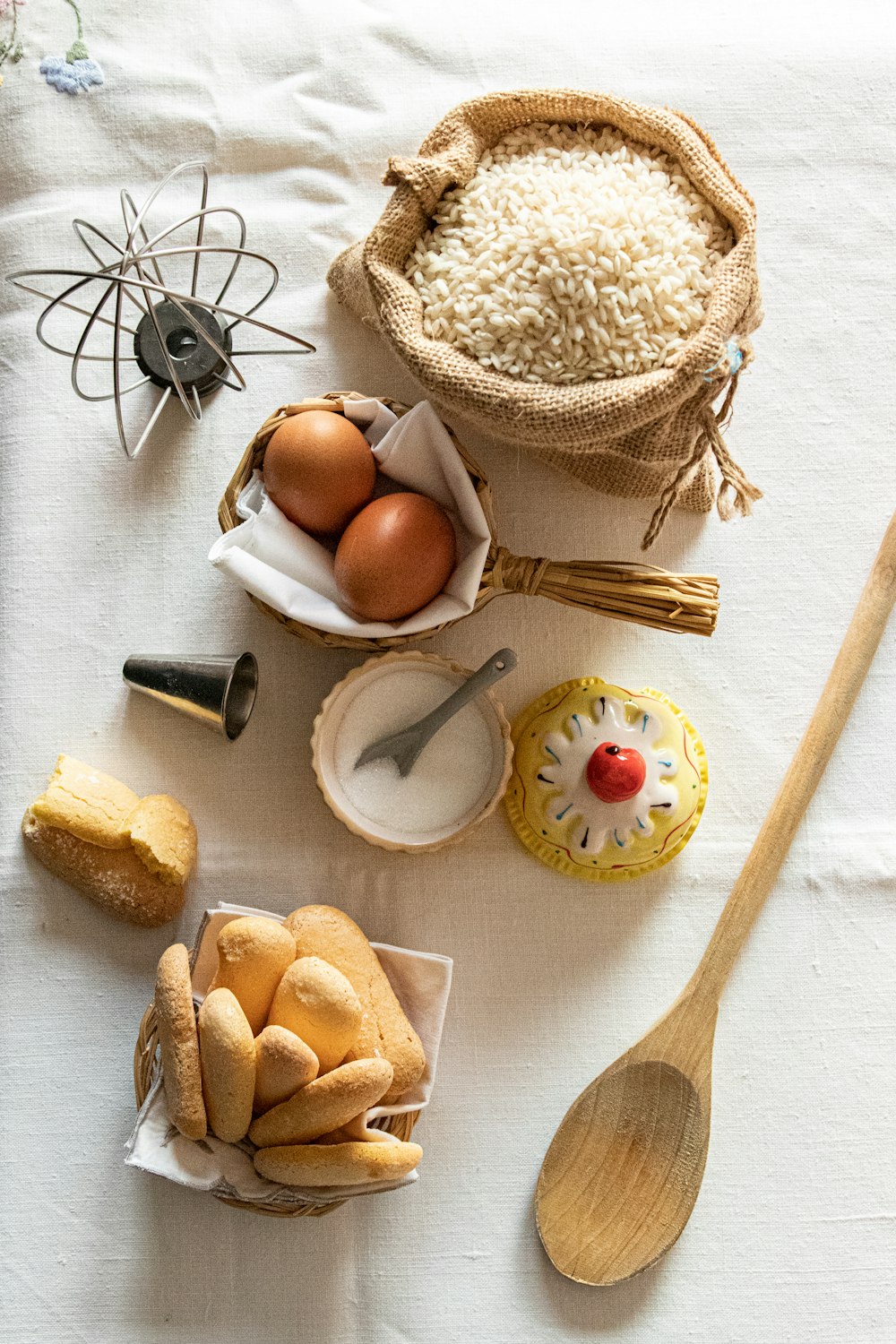 brown wooden spoon on white textile