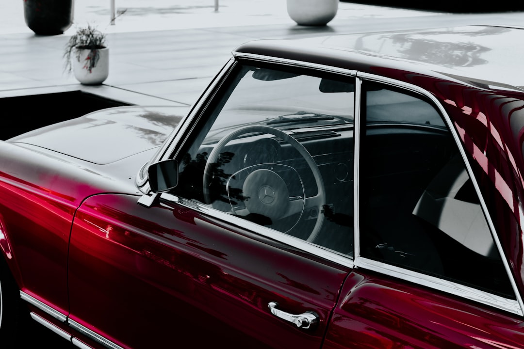 red car in front of white car