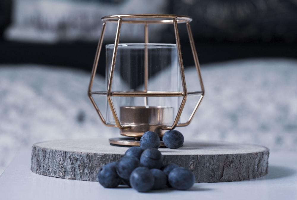 blue stones in clear glass container