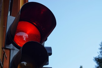 black traffic light with red light