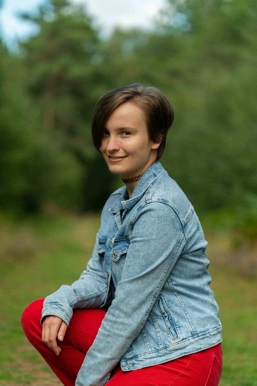 girl in blue denim jacket smiling