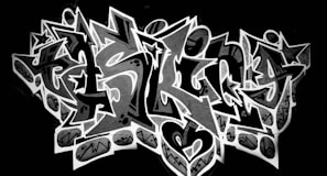 Bold and intricate graffiti design with sharp, angular letters and star motifs, set against a dark background. The central lettering is highlighted by a contrasting outline and embellished with patterns and symbols.