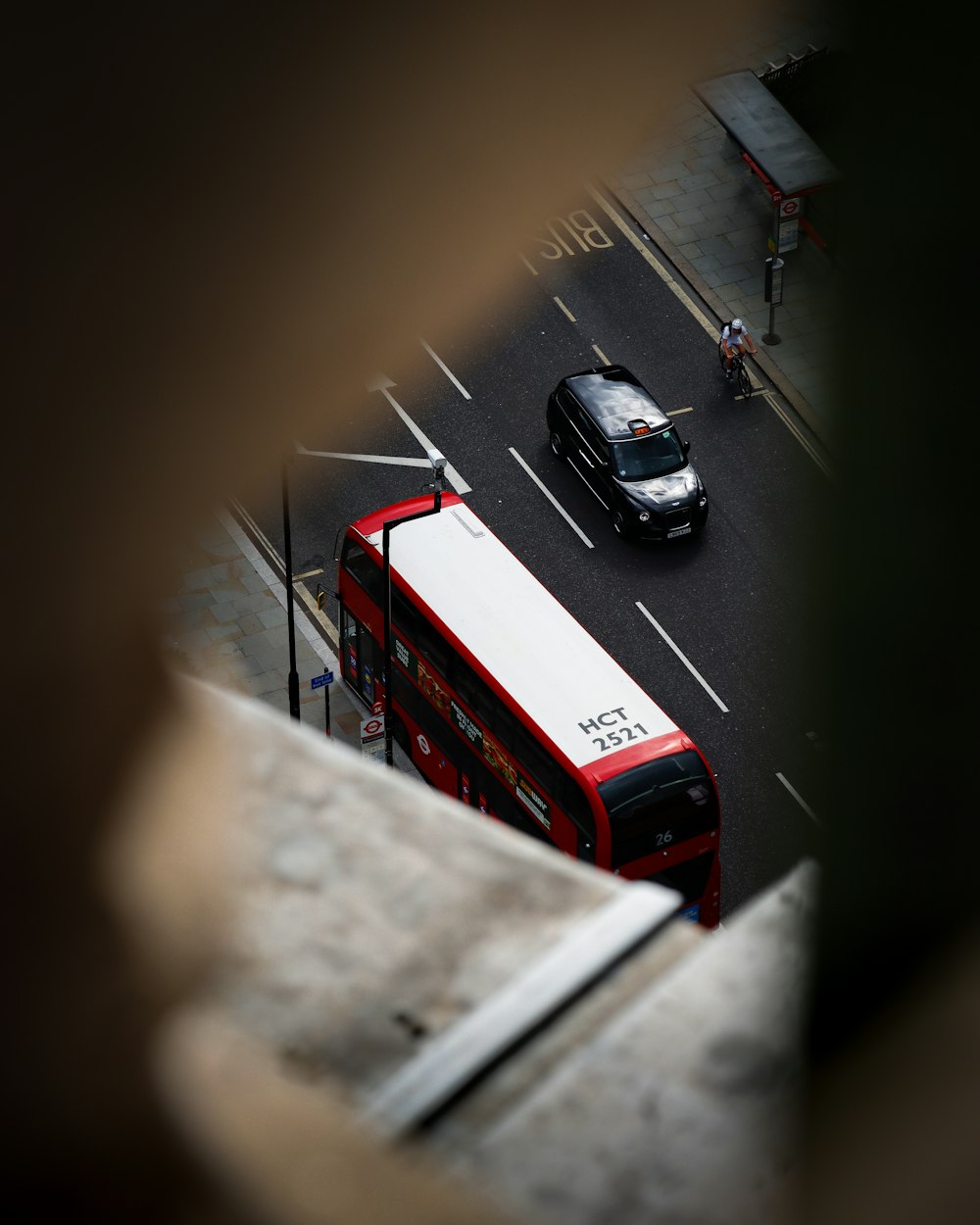 red and white bus on road during daytime