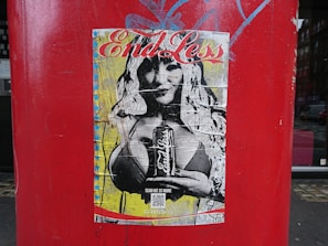 Hands holding a freshly printed poster with comet-themed artwork