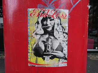 Hands holding a freshly printed poster with comet-themed artwork