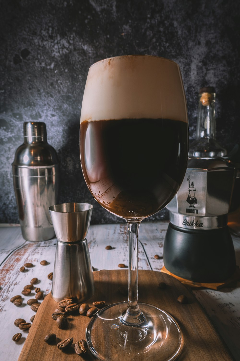 clear wine glass with brown liquid