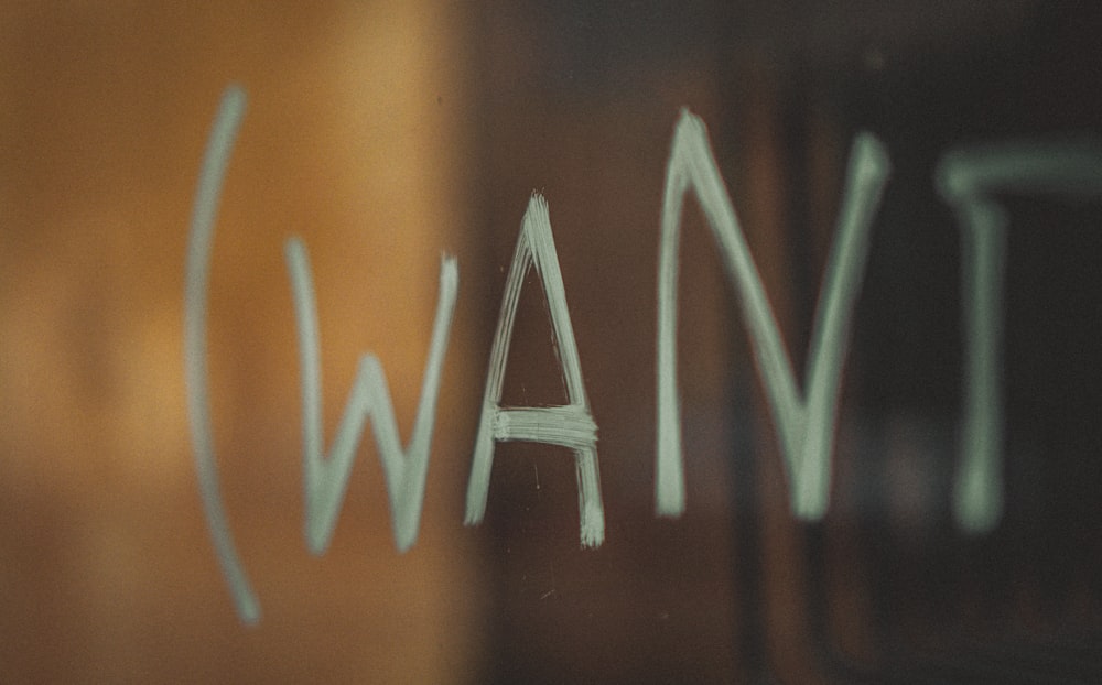 The word "Want" on a shop window"