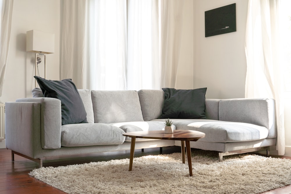 gray sofa with throw pillows