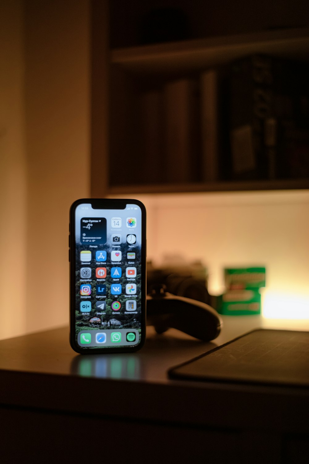 black iphone 5 on black table