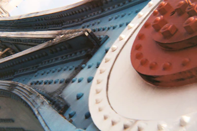 Close-up of detailed steel joints and bolts on a factory building.