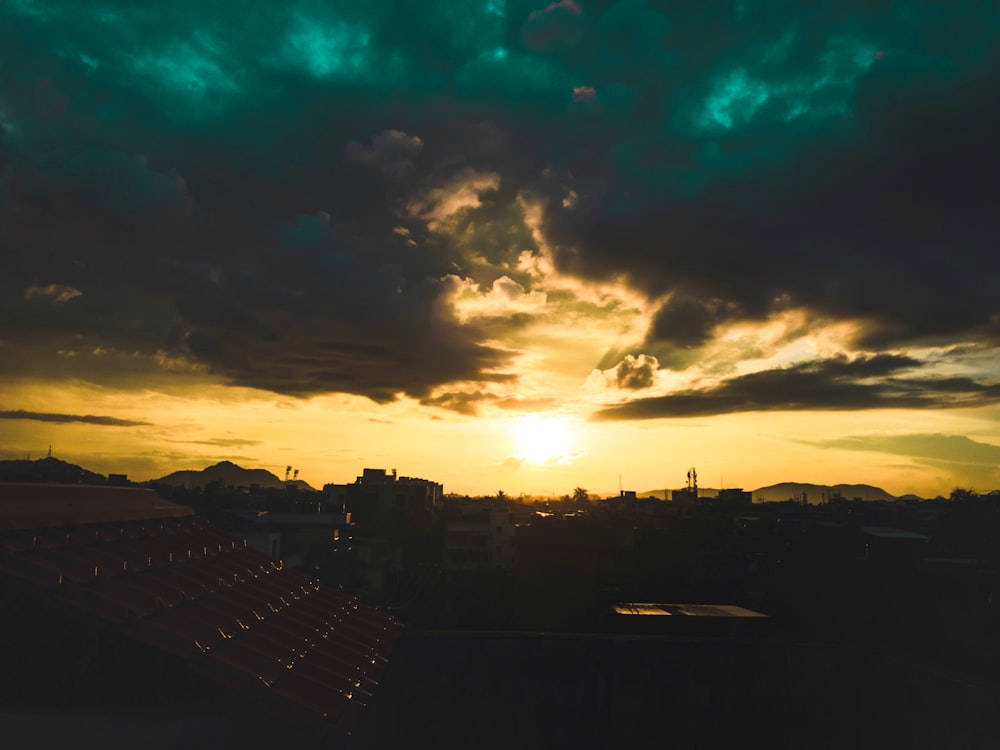 silhouette of city buildings during sunset