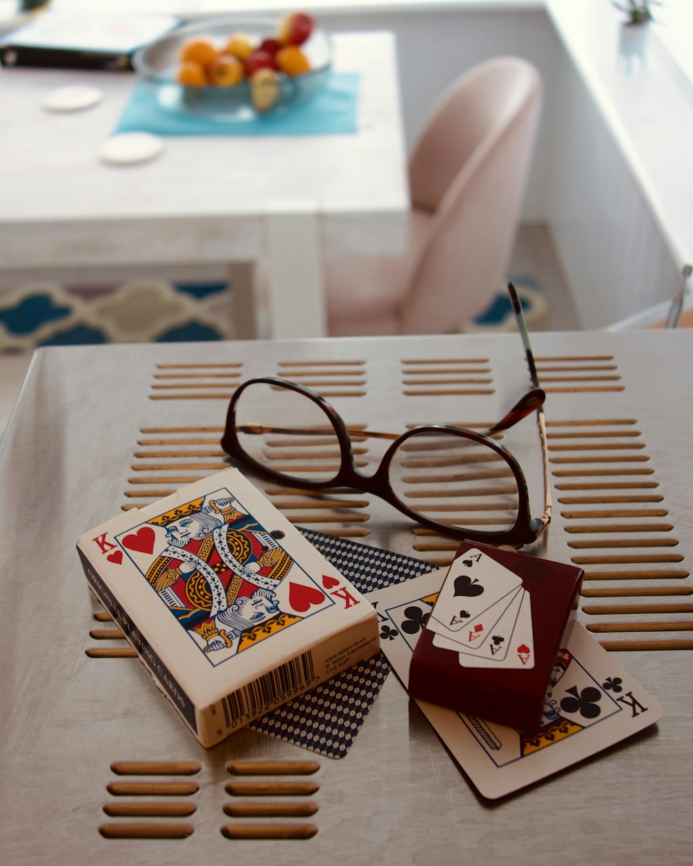 red and white playing cards on white table