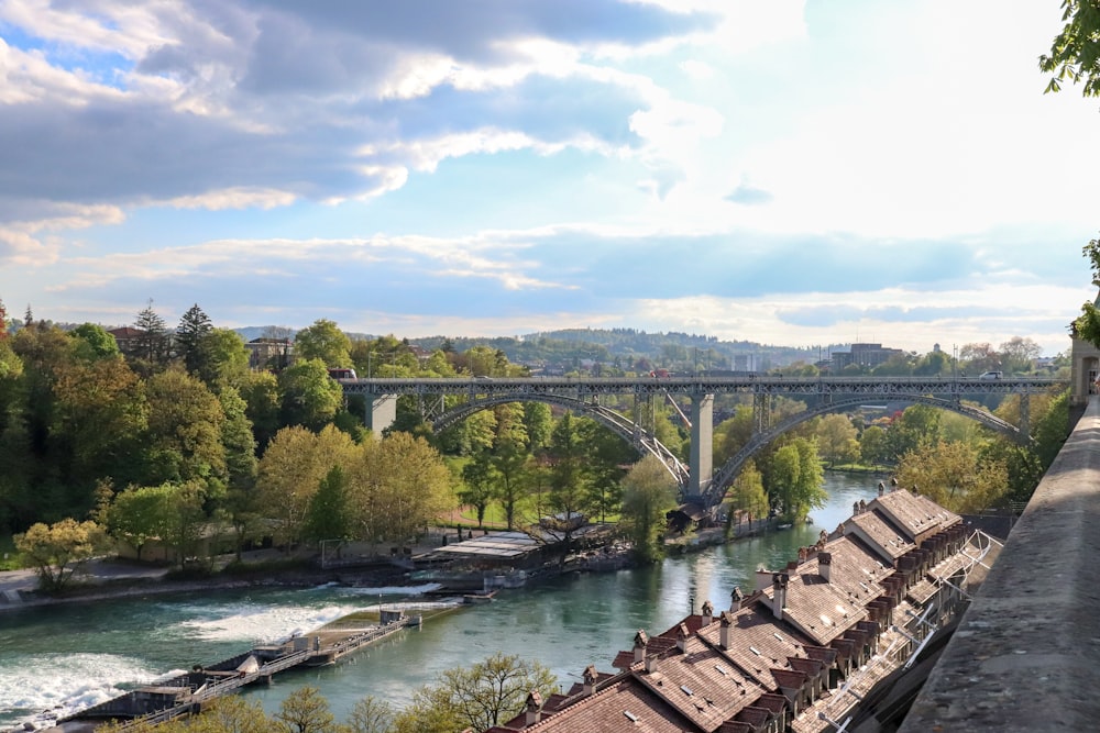 brown wooden bridge over river during daytime