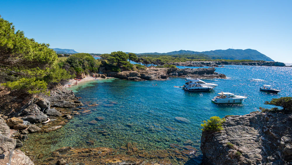 A white boat on open blue sea
