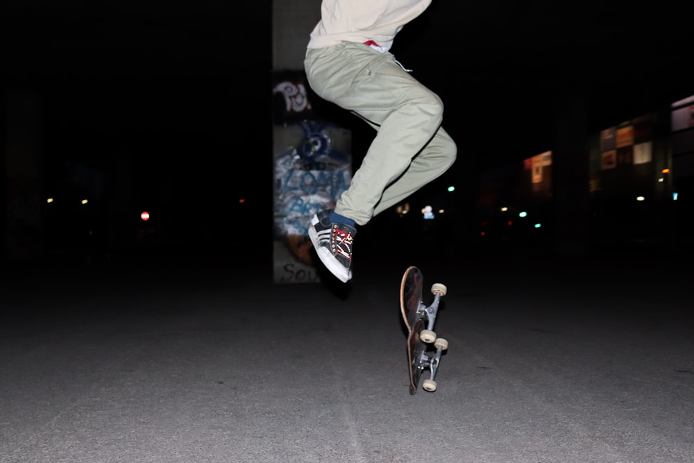 a man flying through the air while riding a skateboard