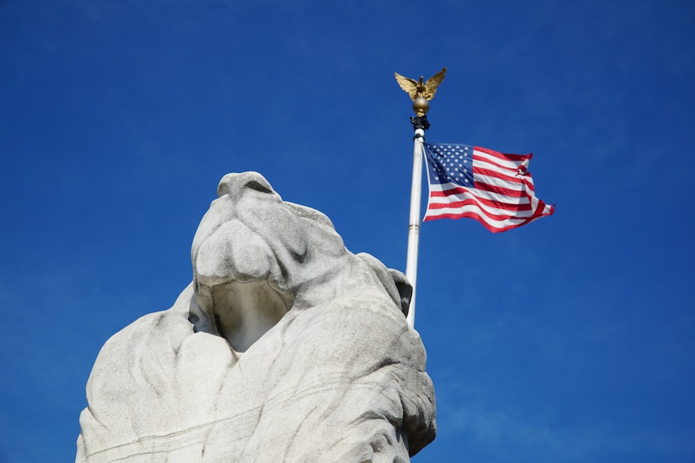 us a flag on gray concrete statue