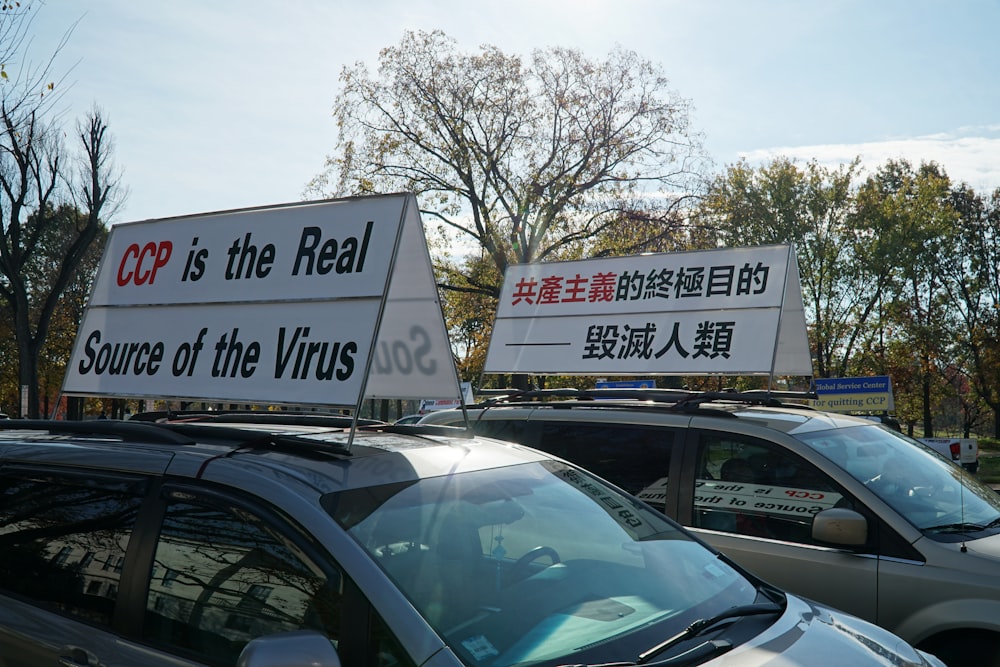 black car with white and blue signage