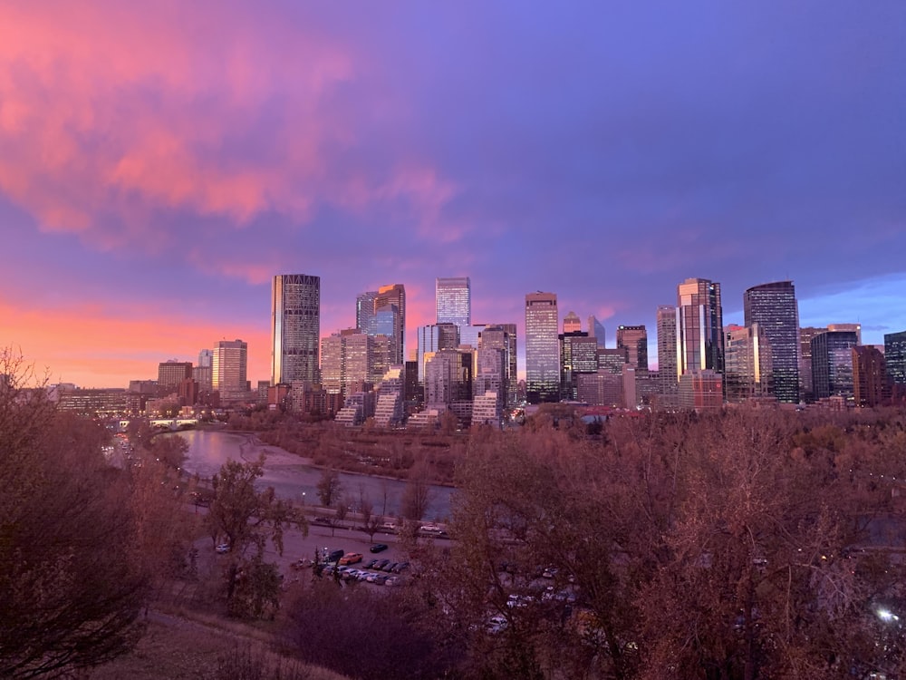 city skyline under cloudy sky during daytime