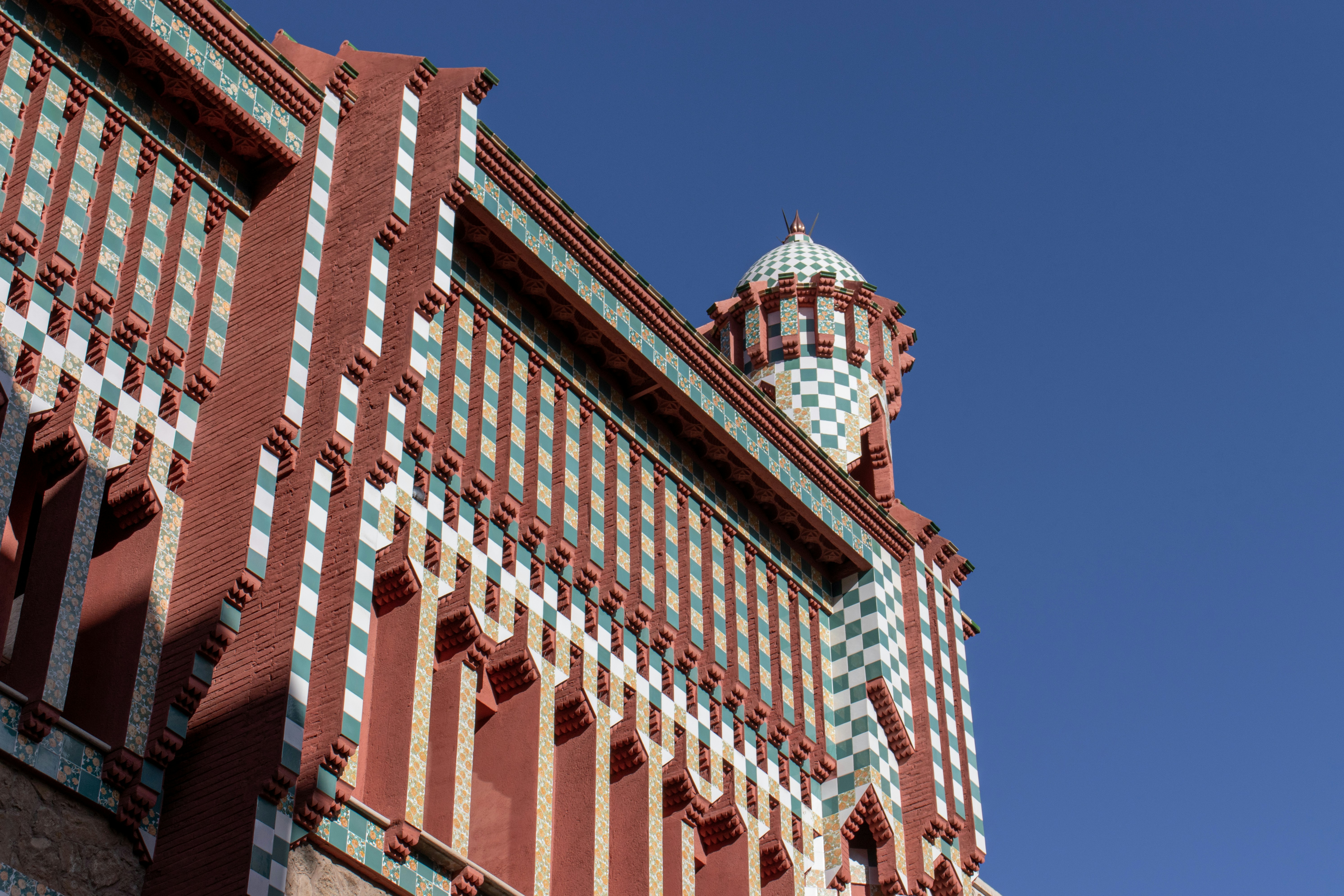 red and white concrete building under blue sky during daytime
