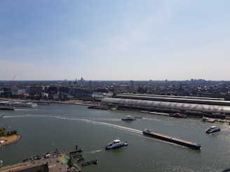 A panoramic view of Rhineport’s Amsterdam facility exterior under a clear blue sky.
