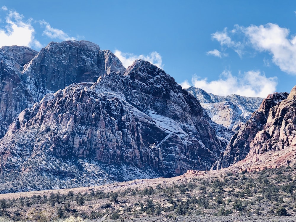 gray rocky mountain under blue sky during daytime