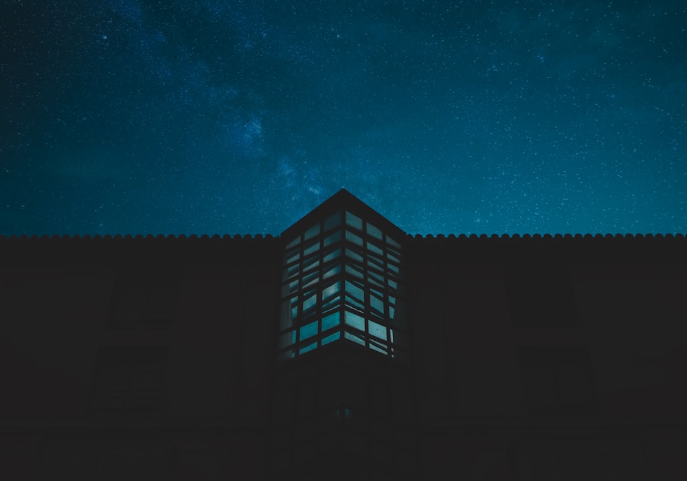 black and white building under blue sky