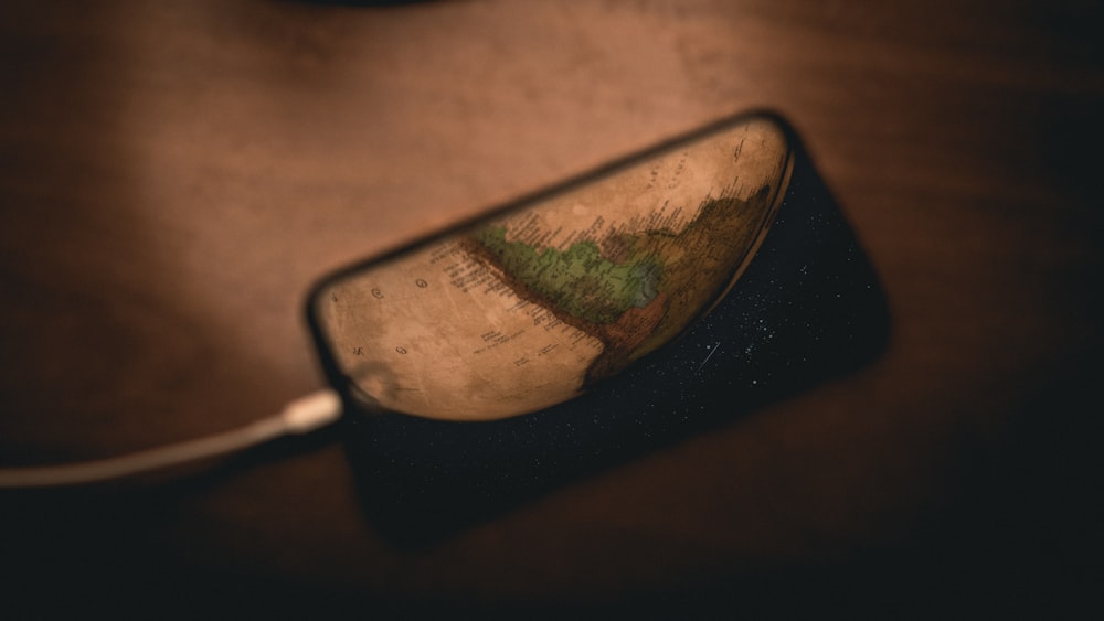 black framed eyeglasses on brown wooden table