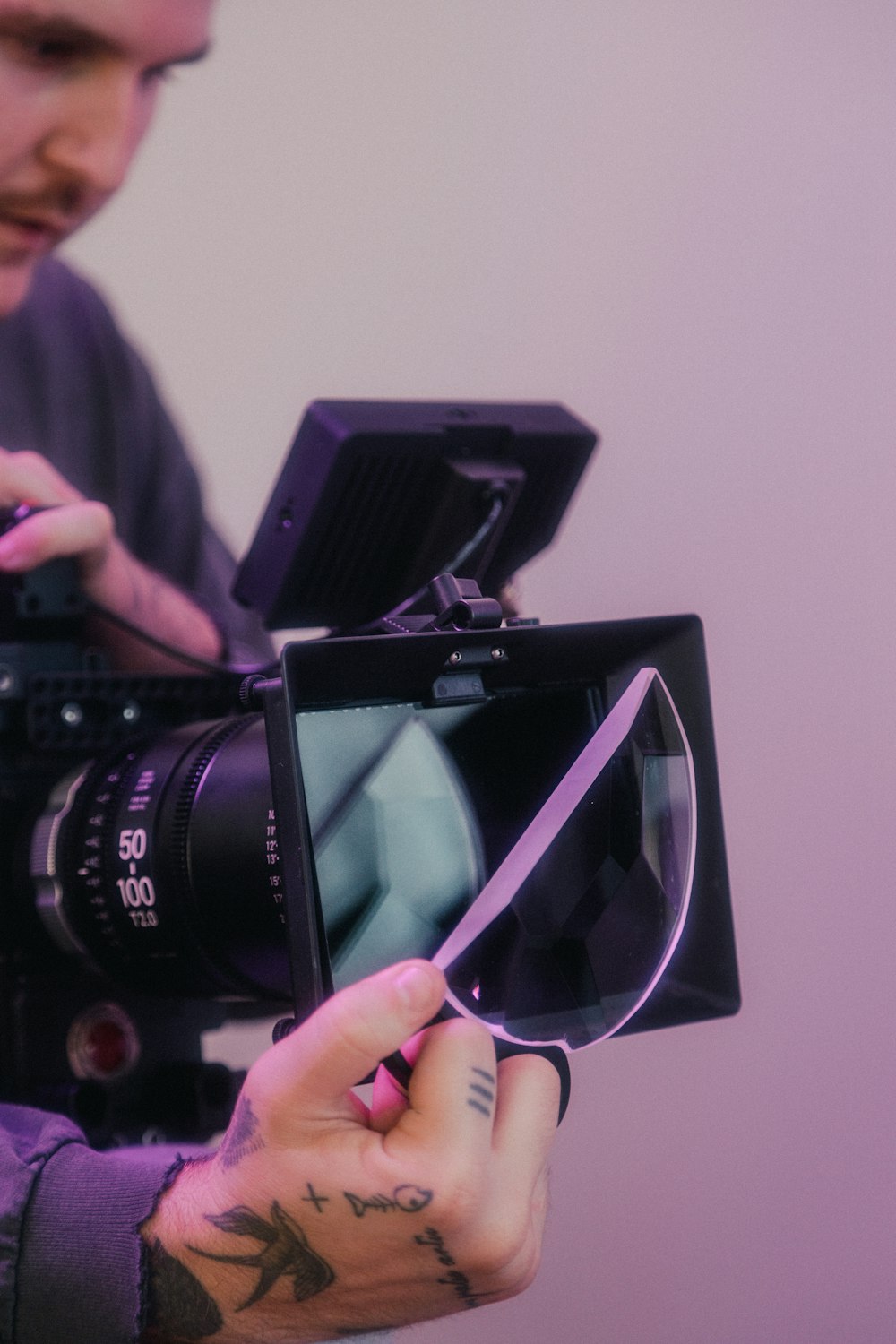 person holding black nikon dslr camera